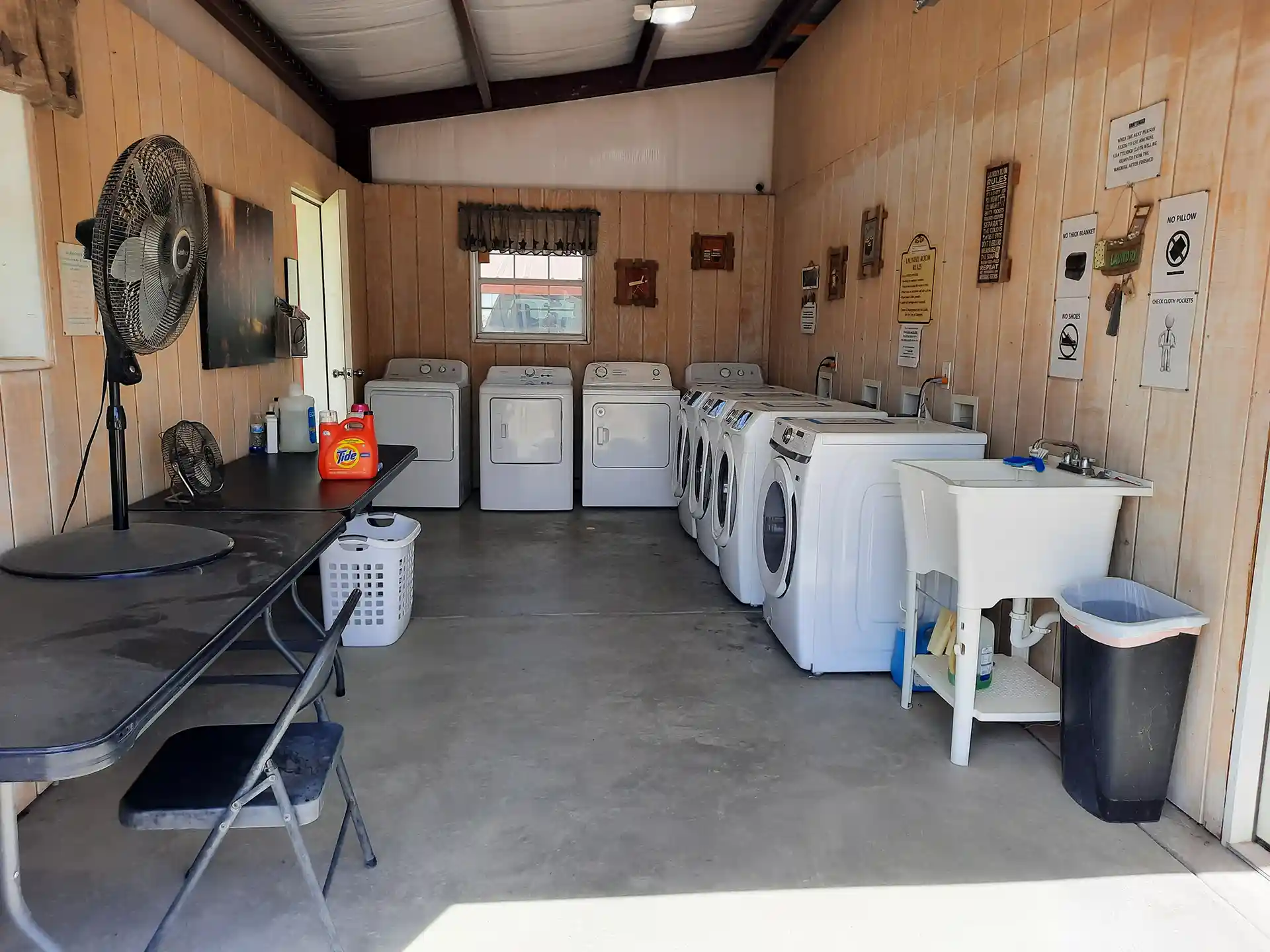 a laundry room with multiple machines